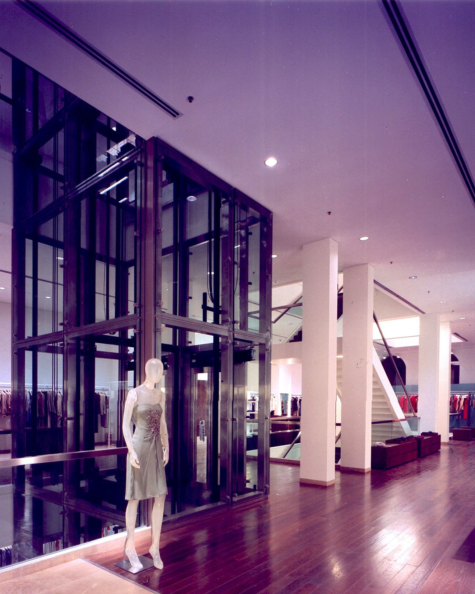 Finished retail store, with display furniture and custom wood panelling.